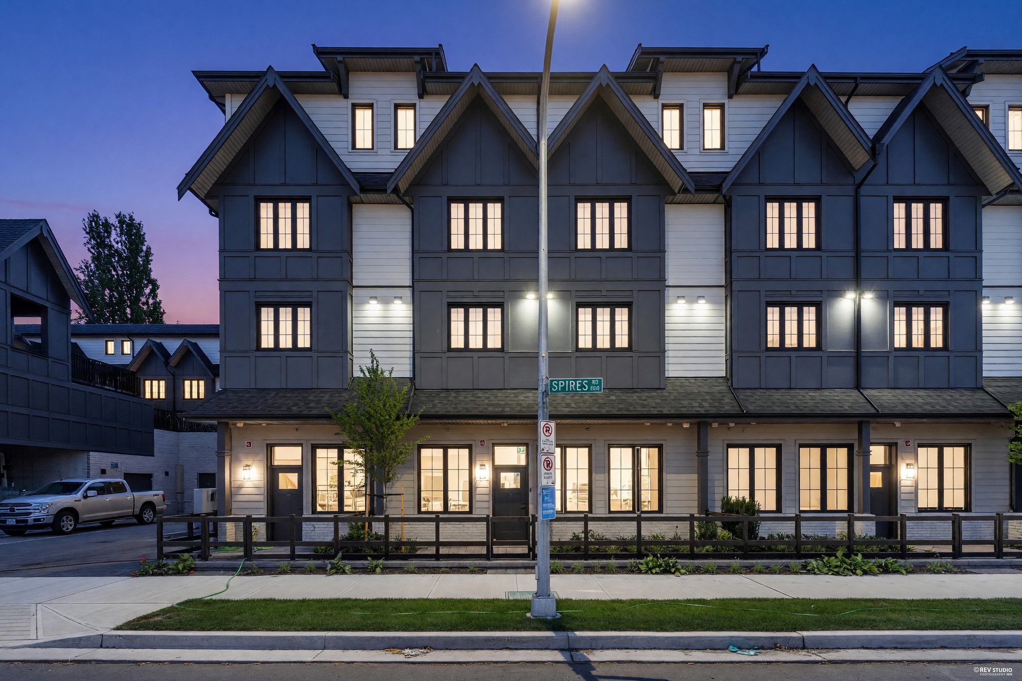 A new townhouse row on Spires Road, Richmond, photographed at dusk